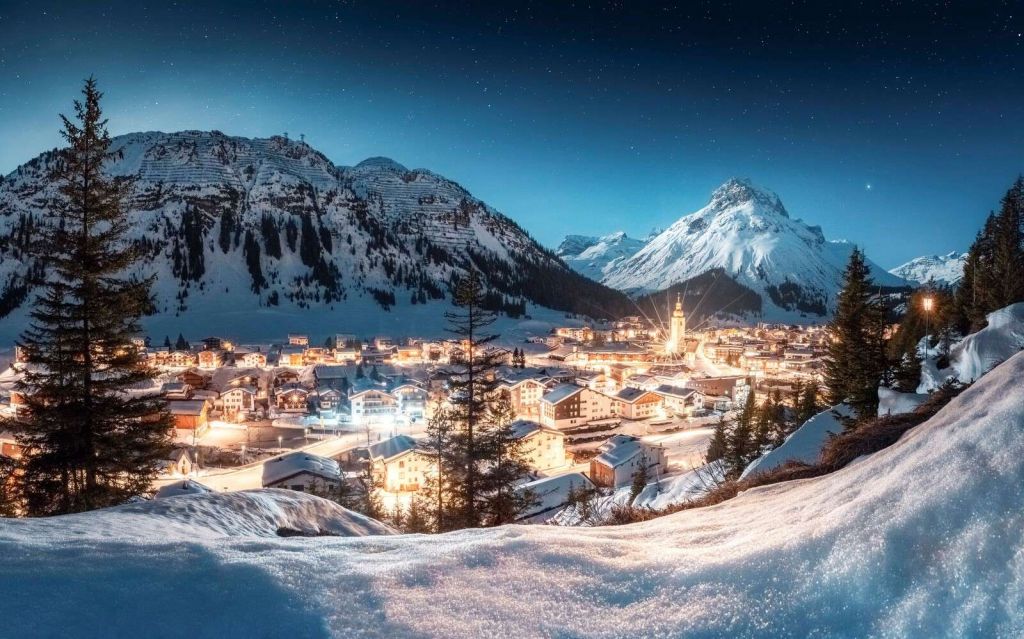 Village alpin scintillant sous un ciel étoilé